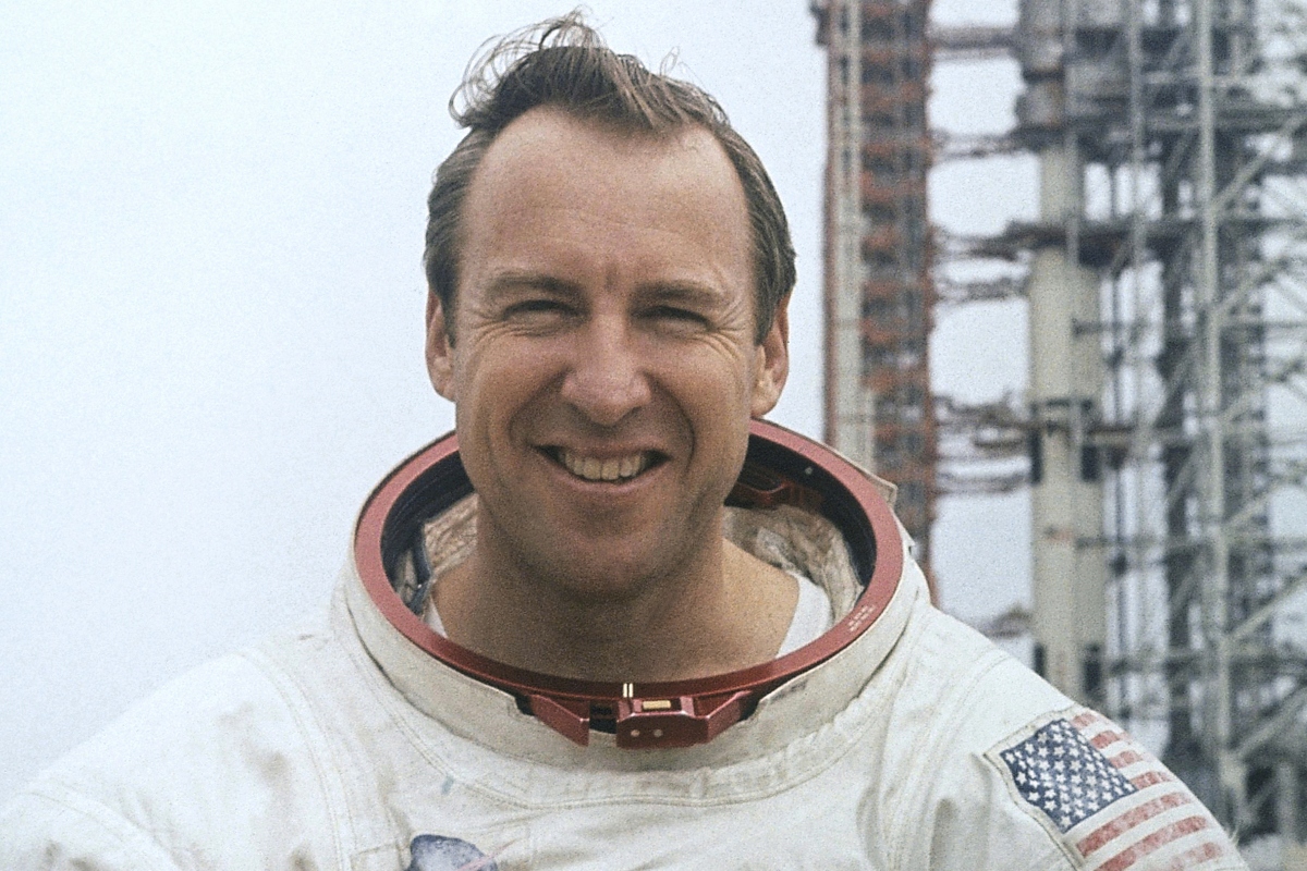 FILE - In this photo provided by NASA, astronaut James Lovell, Apollo 13 commander poses for a portrait in his space suit, Feb. 16, 1970. (AP Photo/NASA, File)