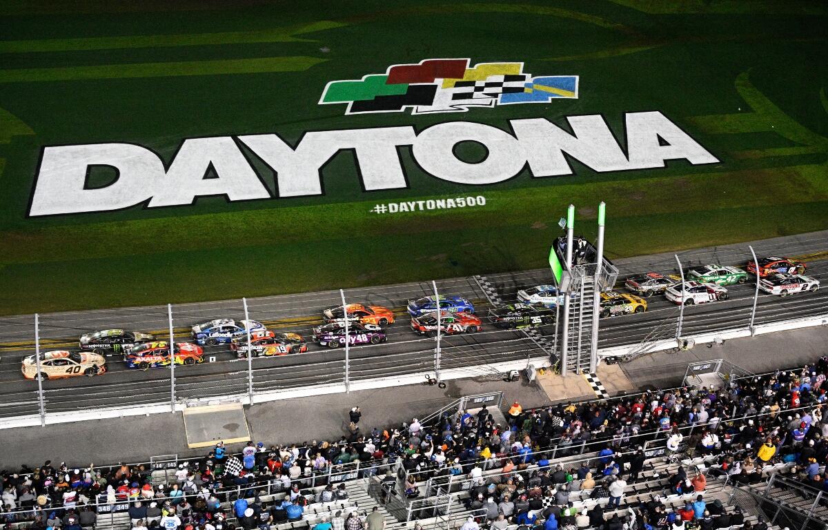 FILE - Drivers pass the start line after a caution during the NASCAR Daytona 500 auto race at Daytona International Speedway, Feb. 16, 2025, in Daytona Beach, Fla. (AP Photo/Phelan M. Ebenhack, File)