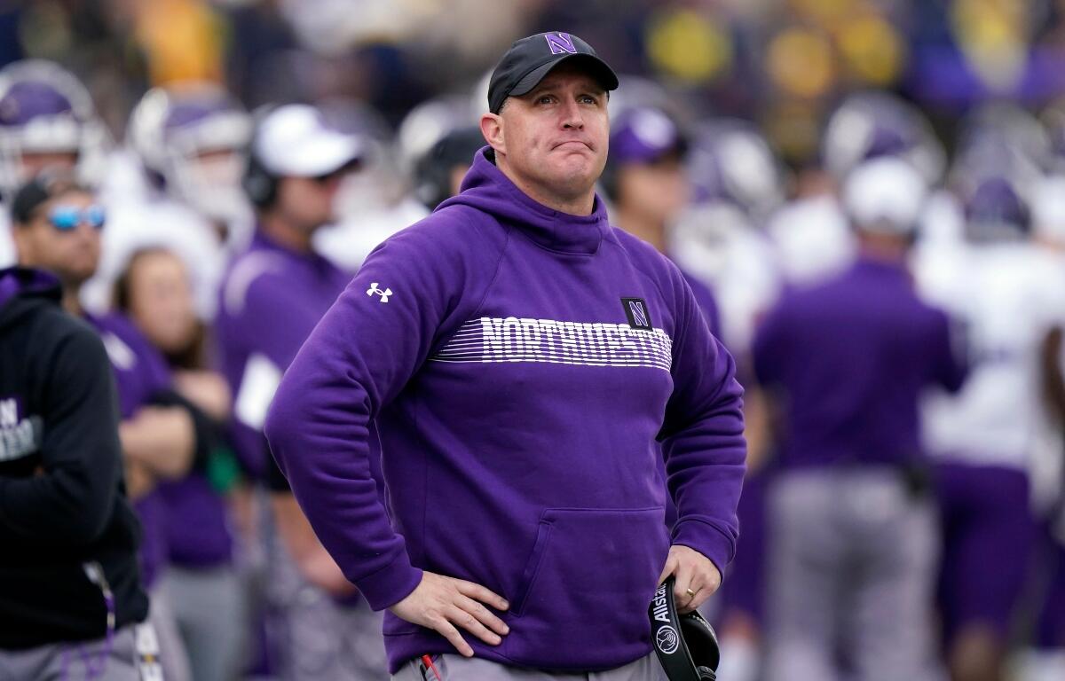 FILE - Northwestern head coach Pat Fitzgerald stands on the sideline during the first half of an NCAA college football game against Michigan, Oct. 23, 2021, in Ann Arbor, Mich. (AP Photo/Carlos Osorio, File)