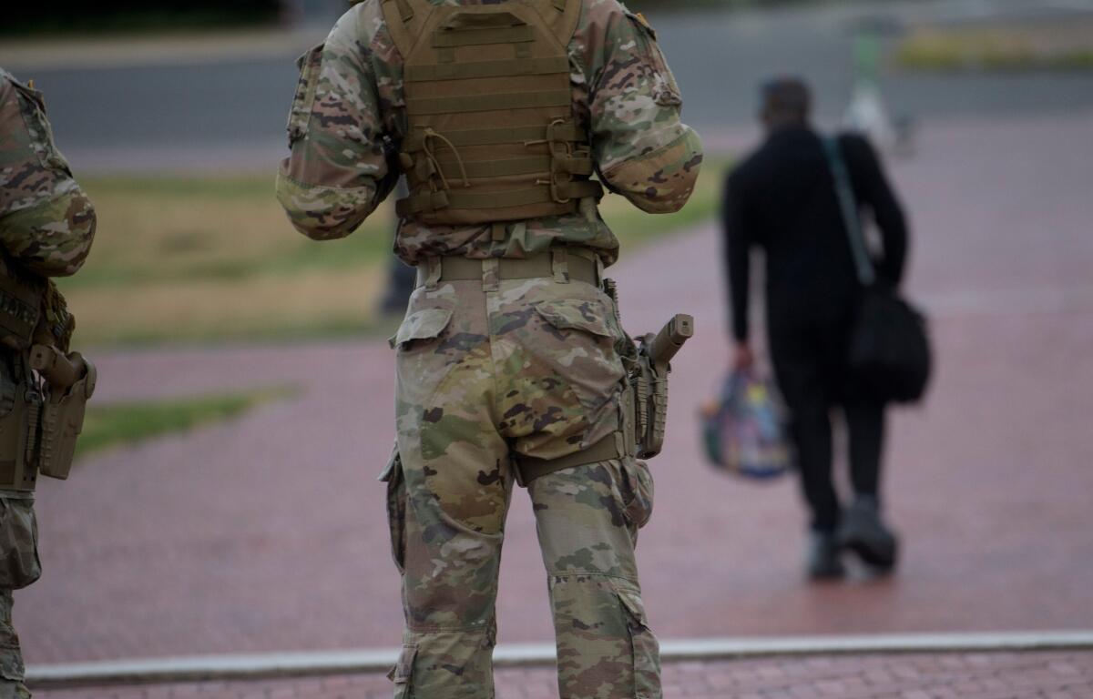 Armed members of the South Carolina National Guard are positioned outside of Union Station in Washington, Sunday, Aug. 24, 2025. (AP Photo/Rod Lamkey, Jr.)