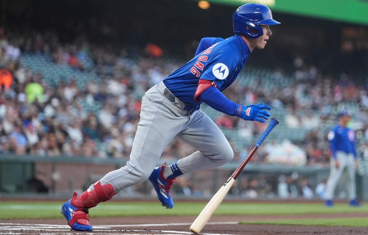 Chicago Cubs' Pete Crow-Armstrong runs to first base after hitting a single against the San Francisco Giants during the first inning of a baseball game in San Francisco, Tuesday, Aug. 26, 2025. (AP Photo/Jeff Chiu)