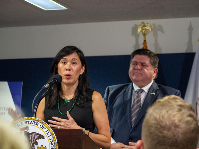 Illinois Deputy Governor for Health and Human Services Grace Hou appears alongside Gov. JB Pritzker at a Springfield news conference in 2023. (Capitol News Illinois photo by Jerry Nowicki)