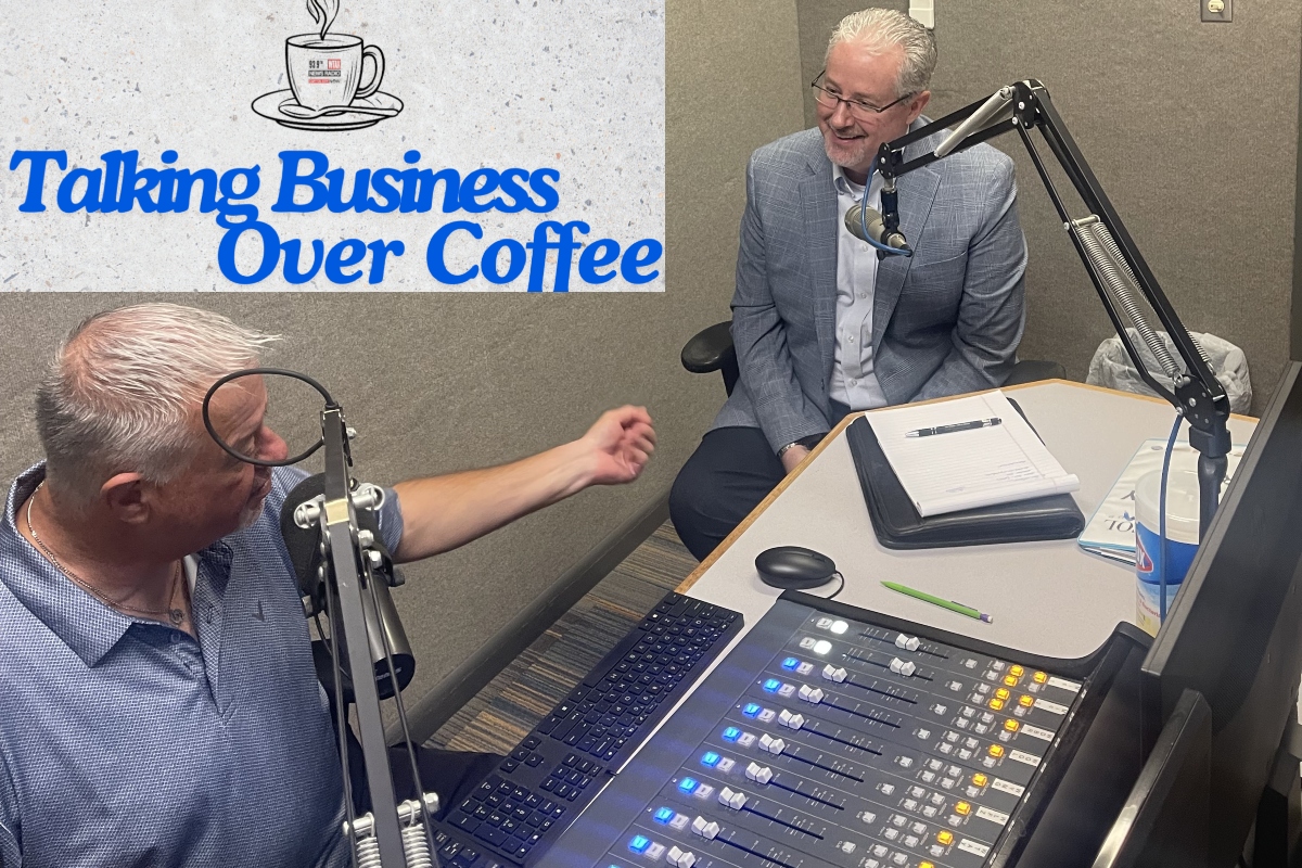 Chris Bullock, left, talks with Tim Whisler of The Whisler Agency.