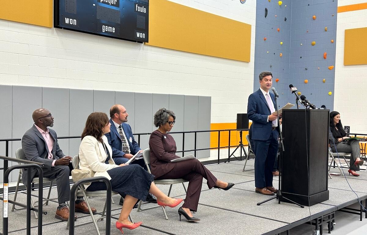 Rob Vickery, Acting Director of the Illinois Department of Juvenile Justice, speaks at a grand opening ceremony in the Monarch Youth Center's multi-purpose room.