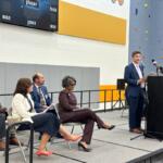 Rob Vickery, Acting Director of the Illinois Department of Juvenile Justice, speaks at a grand opening ceremony in the Monarch Youth Center's multi-purpose room.