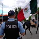 Police watch during the 2025 Pilsen Mexican Independence Day parade Saturday, Sept. 6, 2025, in Chicago. (AP Photo/Carolyn Kaster)