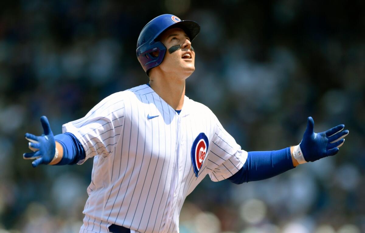 FILE - Chicago Cubs' Anthony Rizzo celebrates at third base after hitting a solo home run during the first inning of a baseball game against the Arizona Diamondbacks Sunday, July 25, 2021, in Chicago. (AP Photo/Paul Beaty, File)