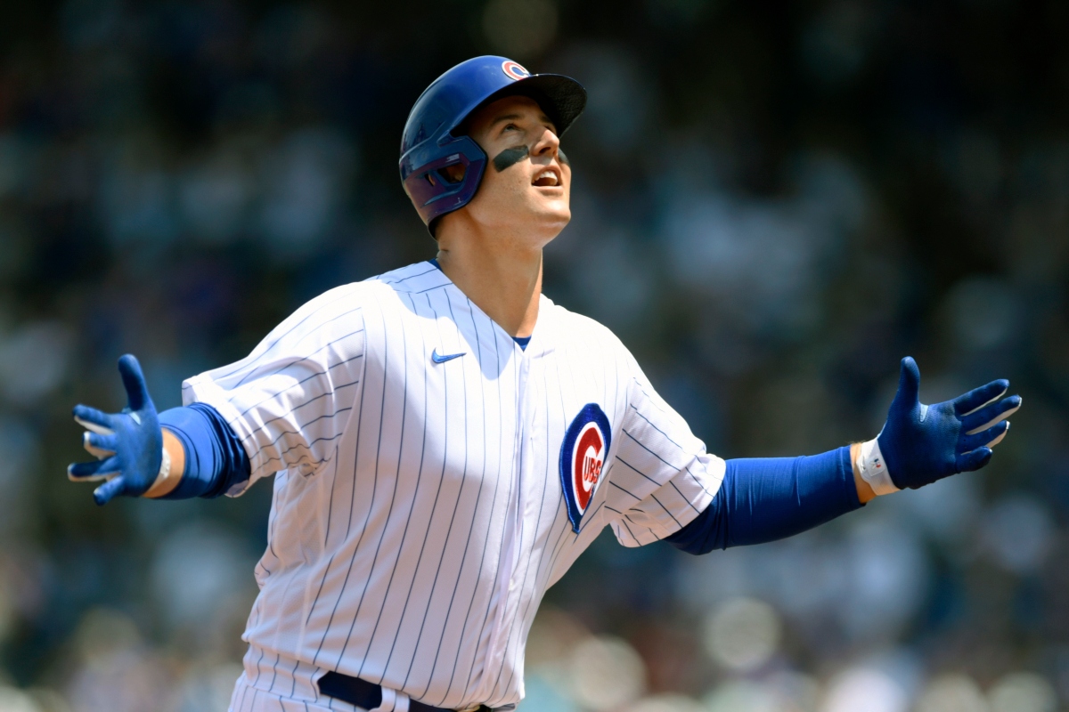 FILE - Chicago Cubs' Anthony Rizzo celebrates at third base after hitting a solo home run during the first inning of a baseball game against the Arizona Diamondbacks Sunday, July 25, 2021, in Chicago. (AP Photo/Paul Beaty, File)