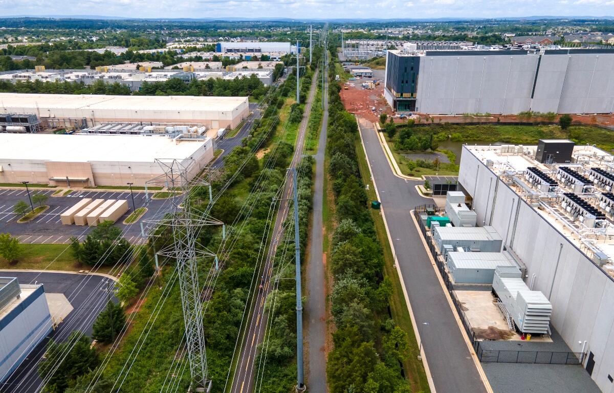 FILE - High-voltage transmission lines provide electricity to data centers in Ashburn in Loudon County, Virginia, on Sunday, July 16, 2023. (AP Photo/Ted Shaffrey, File)