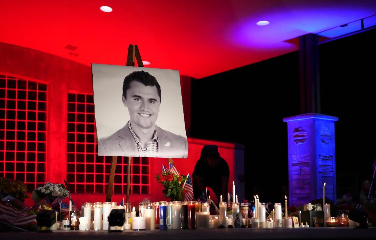 A photo of Charlie Kirk, the CEO and co-founder of Turning Point USA who was shot and killed, stands at his vigil, Thursday, Sept. 11, 2025, in Orem, Utah. (AP Photo/Lindsey Wasson)