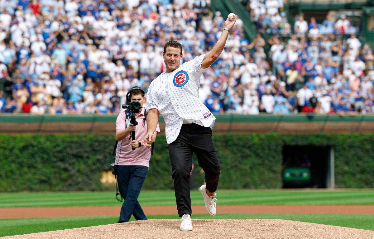 Former Chicago Cubs player Anthony Rizzo throws out a ceremonial first pitch before a baseball game between the Tampa Bay Rays and Chicago Cubs, Saturday, Sept. 13, 2025, in Chicago. (AP Photo/Kamil Krzaczynski)