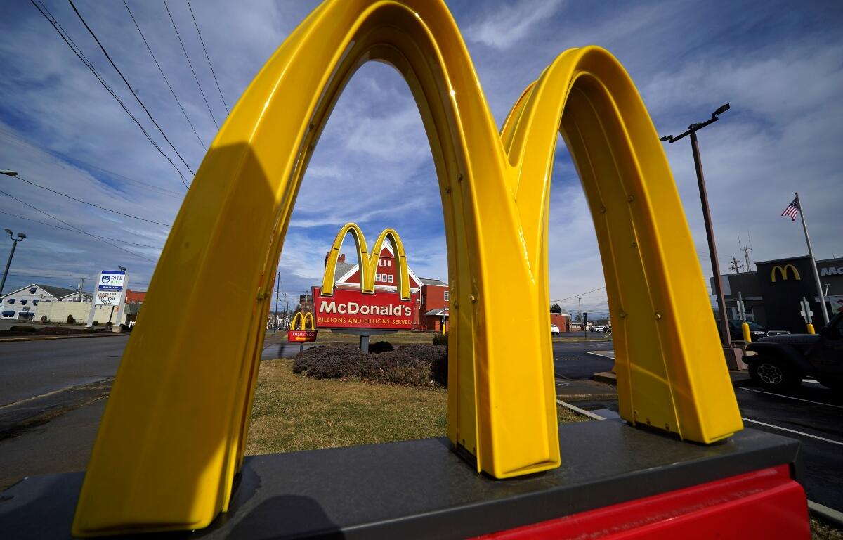 FILE - McDonald's restaurant signs are shown in in East Palestine, Ohio, Feb. 9, 2023. (AP Photo/Gene J. Puskar, File)