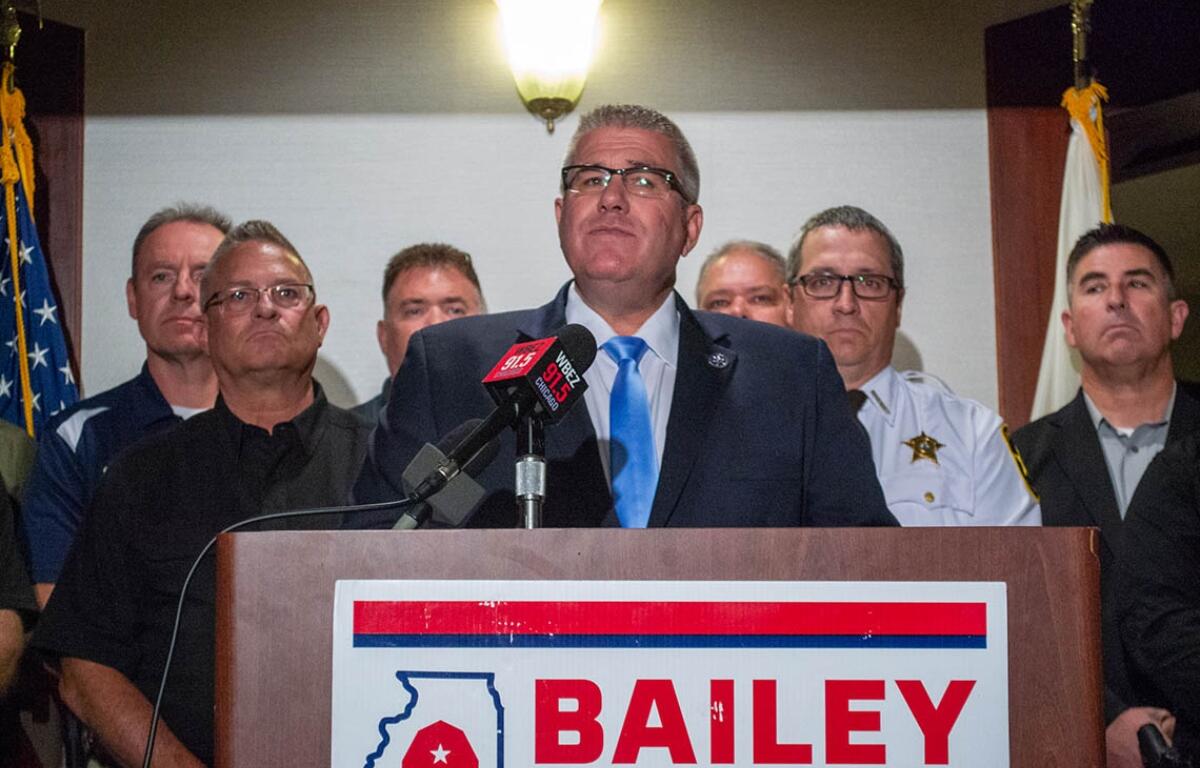 State Sen. Darren Bailey appears at a news conference alongside law enforcement officers during his 2022 campaign for governor. (Capitol News Illinois photo by Jerry Nowicki)