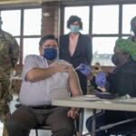Gov. JB Pritzker receives his COVID-19 vaccine in 2022 at the Illinois State Fairgrounds. (Capitol News Illinois photo by Jerry Nowicki)