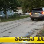 Three people were killed Thursday at the house, seen left, in the 3000 block of Hoover Ave.