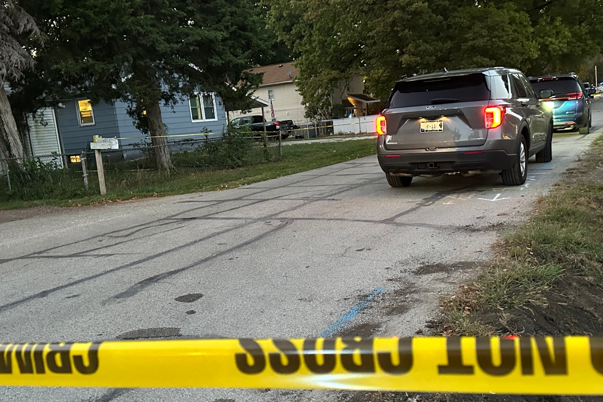 Three people were killed Thursday at the house, seen left, in the 3000 block of Hoover Ave.