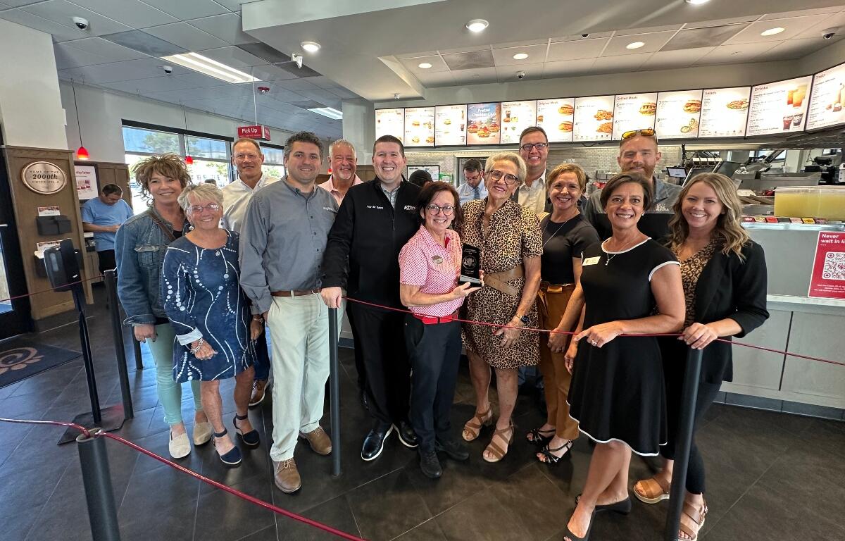 Members of the Central Illinois Customer Service Association present their quarterly "WOW Award" to Candy Loyd of Chick-Fil-A.