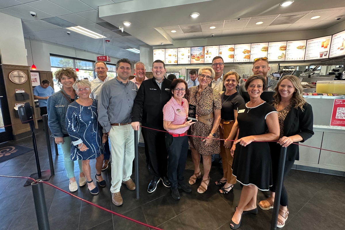 Members of the Central Illinois Customer Service Association present their quarterly "WOW Award" to Candy Loyd of Chick-Fil-A.