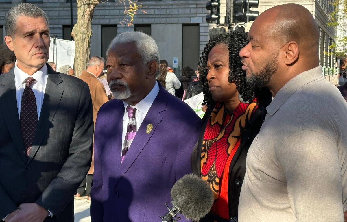 Left to right: Anthony Romanucci, James Wilburn, Teresa Haley, and Sontae Massey, all speaking with a reporter Wednesday afternoon in downtown Peoria.