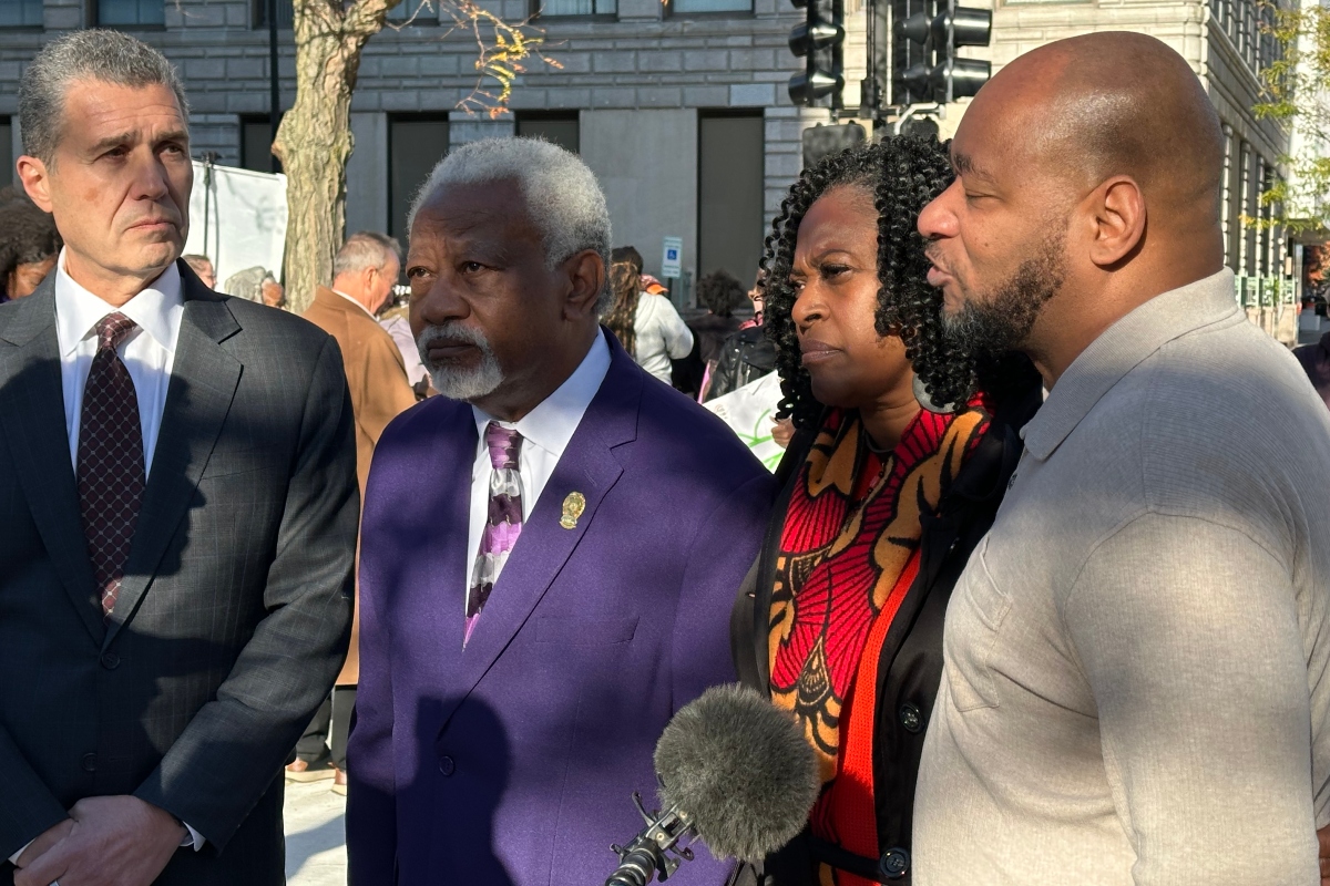 Left to right: Anthony Romanucci, James Wilburn, Teresa Haley, and Sontae Massey, all speaking with a reporter Wednesday afternoon in downtown Peoria.