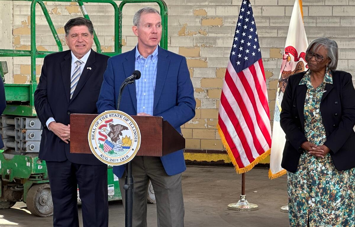 L to R: Gov. JB Pritzker, Chris Richmond, State Sen. Doris Turner.