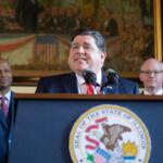 Gov. JB Pritzker holds a news conference alongside House Speaker Chris Welch, left, and Senate President Don Harmon in May 2023 at the Illinois Capitol. (Capitol News Illinois photo by Jerry Nowicki)