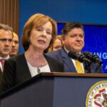 Ann Gillespie, a former state senator who is now the state’s insurance department director, is pictured at a news conference with Gov. JB Pritzker and others in 2023. (Capitol News Illinois photo by Andrew Adams)