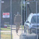 A man in military-style fatigues walks outside an Immigration and Customs Enforcement facility in Broadview on Oct. 9. National Guard troops were deployed to the facility earlier in the day. (Capitol News Illinois photo by Andrew Adams)