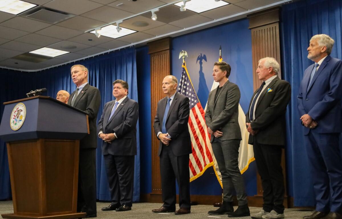 Ret. Maj. Gen. Randy Manner condemns the use of military troops to support domestic law enforcement at an Oct. 16 news conference alongside Gov. JB Pritzker and other retired military officers. Also pictured, from left to right: Lt. Gen. Charles Luckey, Gov. JB Pritzker, Maj. Gen. William Enyart, Capt. Janessa Goldbeck, Maj. Gen. Paul Eaton and Rear Adm. Michael Smith. (Capitol News Illinois photo by Andrew Adams)