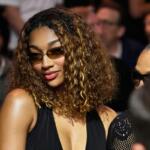 WNBA basketbal player Angel Reese sits at ringside during a super welterweight boxing match between Callum Walsh and Fernando Vargas Jr. in Las Vegas, Saturday, Sept. 13, 2025. (AP Photo/David Becker)