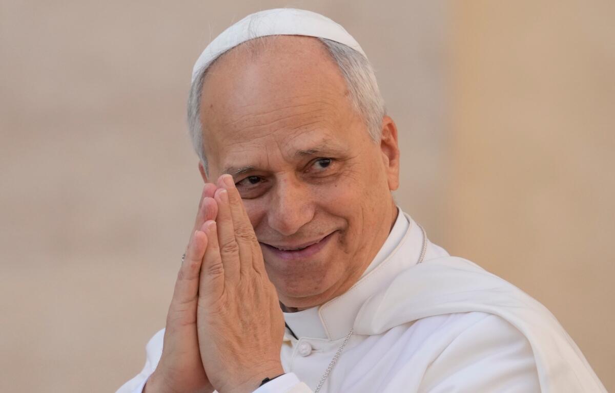 Pope Leo XIV gestures as he arrives for his weekly general audience in St. Peter's Square at The Vatican, Wednesday, Oct.1, 2025. (AP Photo/Gregorio Borgia)