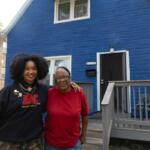 Artist Tonika Lewis Johnson and local resident Justine Stephens, right, stand for portrait in the 6500-block of South Aberdeen Street in Chicago's Englewood neighborhood, on Monday, Oct. 6, 2025. (AP Photo/Talia Sprague)