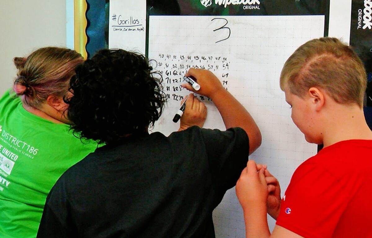 Students do math problems at an elementary school in Springfield. (Capitol News Illinois photo by Andrew Campbell)
