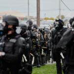 Law enforcement officers line up as protesters gather outside an ICE processing facility in the Chicago suburb of Broadview, Ill., Saturday, Nov. 1, 2025. (AP Photo/Alex Brandon)