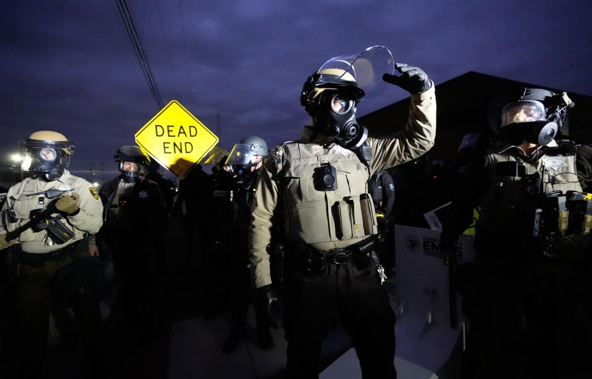 Law enforcement standoff with protesters outside an ICE processing facility in the Chicago suburb of Broadview, Ill., Saturday, Nov. 1, 2025. (AP Photo/Alex Brandon)