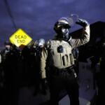 Law enforcement standoff with protesters outside an ICE processing facility in the Chicago suburb of Broadview, Ill., Saturday, Nov. 1, 2025. (AP Photo/Alex Brandon)