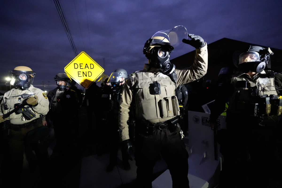 Law enforcement standoff with protesters outside an ICE processing facility in the Chicago suburb of Broadview, Ill., Saturday, Nov. 1, 2025. (AP Photo/Alex Brandon)