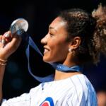 FILE - U.S. Olympic wrestler Kennedy Blades shows her silver medal from the Paris Olympic Games before a baseball game between the Oakland Athletics and the Chicago Cubs in Chicago on Sept. 18, 2024. (AP Photo/Nam Y. Huh, File)