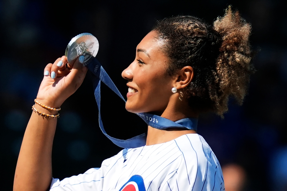 FILE - U.S. Olympic wrestler Kennedy Blades shows her silver medal from the Paris Olympic Games before a baseball game between the Oakland Athletics and the Chicago Cubs in Chicago on Sept. 18, 2024. (AP Photo/Nam Y. Huh, File)