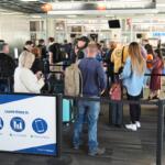 Travelers stand in line in a TSA screening area at Philadelphia International Airport in Philadelphia, Wednesday, Nov. 5, 2025. (AP Photo/Matt Rourke)