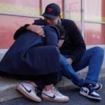 Maria Guzman, left, and Sergio Rocha, parents of young children, comfort each other outside of Rayito de Sol Spanish Immersion Early Learning Center after federal immigration agents took a daycare teacher Wednesday, Nov. 5, 2025, in Chicago. (AP Photo/Erin Hooley)