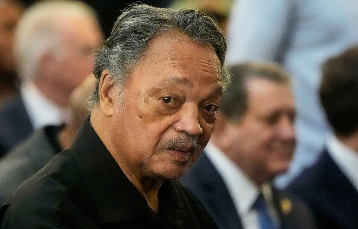 FILE - The Rev. Jesse Jackson listens to speakers at the Tabernacle Baptist Church during the 60th anniversary of the march to ensure that African Americans could exercise their constitutional right to vote, March 9, 2025, in Selma, Ala. (AP Photo/Mike Stewart, File)