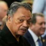 FILE - The Rev. Jesse Jackson listens to speakers at the Tabernacle Baptist Church during the 60th anniversary of the march to ensure that African Americans could exercise their constitutional right to vote, March 9, 2025, in Selma, Ala. (AP Photo/Mike Stewart, File)