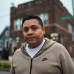 Jose Aguilar, who recorded cell phone video of federal agents chasing and tackling a Black teen in the East Side neighborhood in October, stands outside his family's business Tuesday, Nov. 18, 2025, in Chicago. (AP Photo/Erin Hooley)