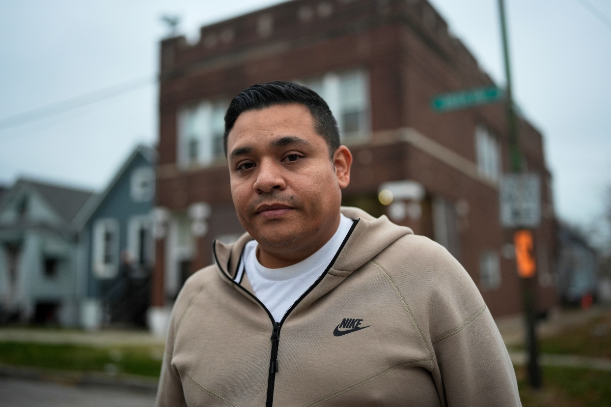 Jose Aguilar, who recorded cell phone video of federal agents chasing and tackling a Black teen in the East Side neighborhood in October, stands outside his family's business Tuesday, Nov. 18, 2025, in Chicago. (AP Photo/Erin Hooley)