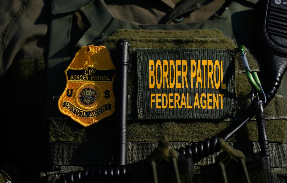 FILE - A Federal Patrol agent's badge is seen near an Immigration and Customs Enforcement facility in Broadview, Ill., Oct. 3, 2025. (AP Photo/Erin Hooley, File)