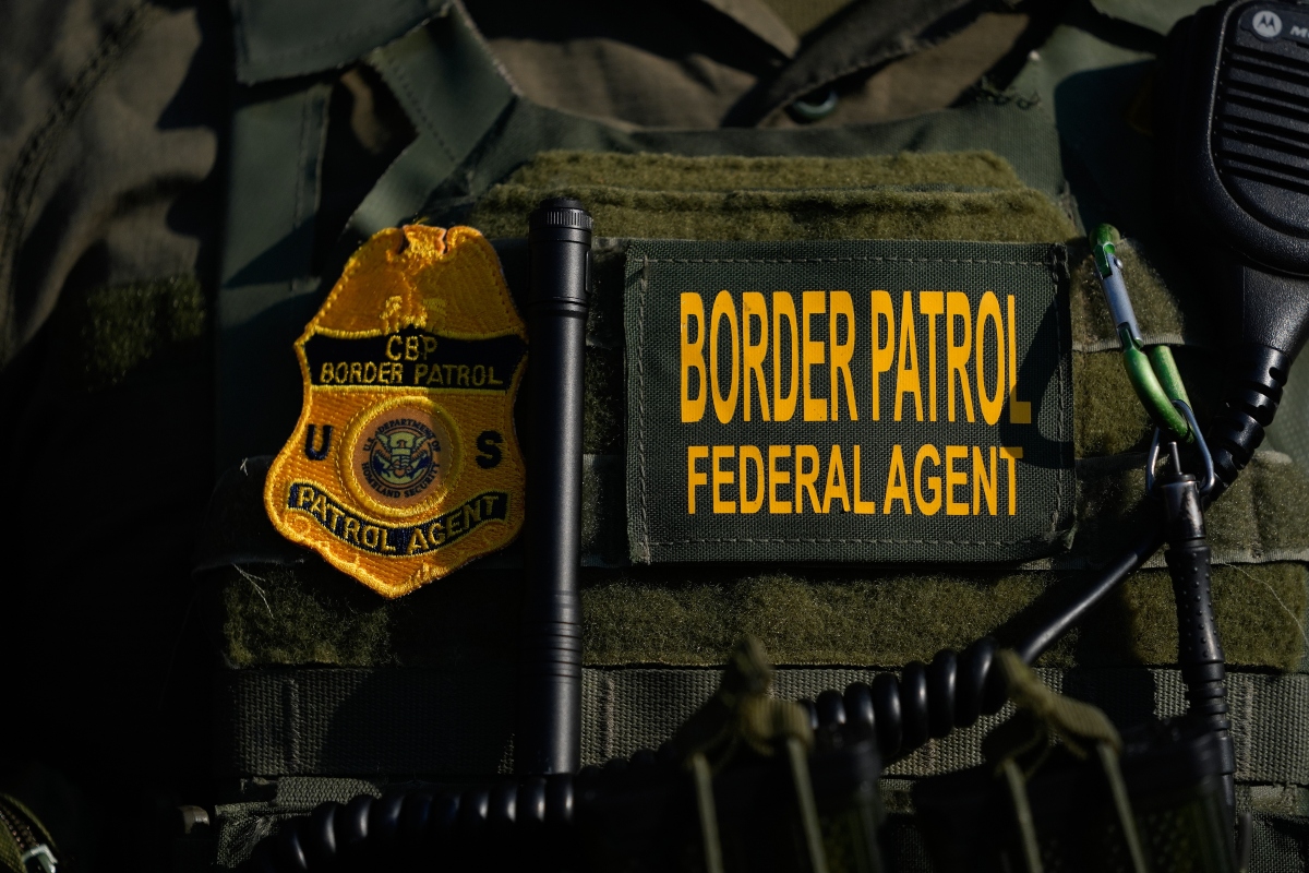 FILE - A Federal Patrol agent's badge is seen near an Immigration and Customs Enforcement facility in Broadview, Ill., Oct. 3, 2025. (AP Photo/Erin Hooley, File)