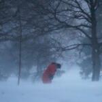 A person walks against the blowing snow Saturday, Nov. 29, 2025, in Chicago. (AP Photo/Kiichiro Sato)
