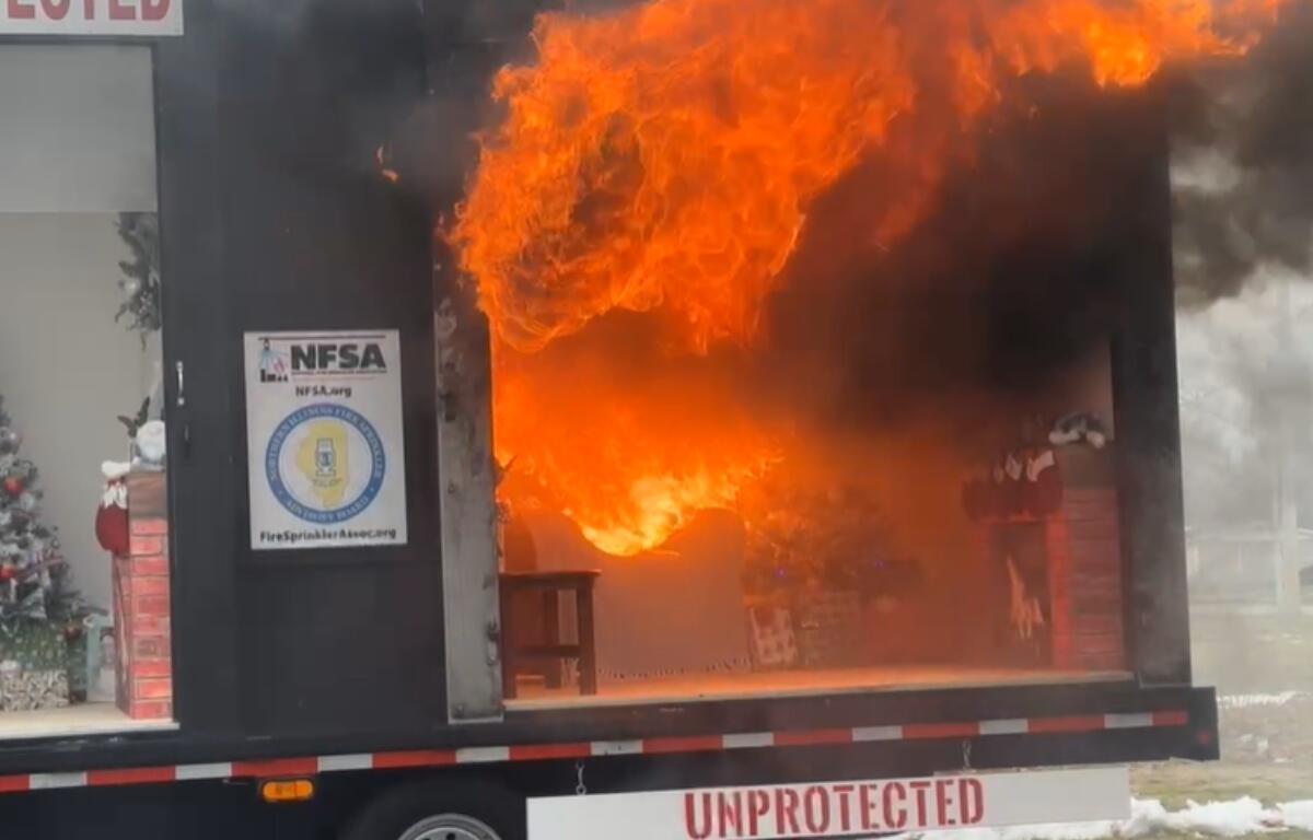 A demonstration trailer shows how quickly a fire can flare up in a home -- in this case, due to a candle being near a Christmas tree and presents.