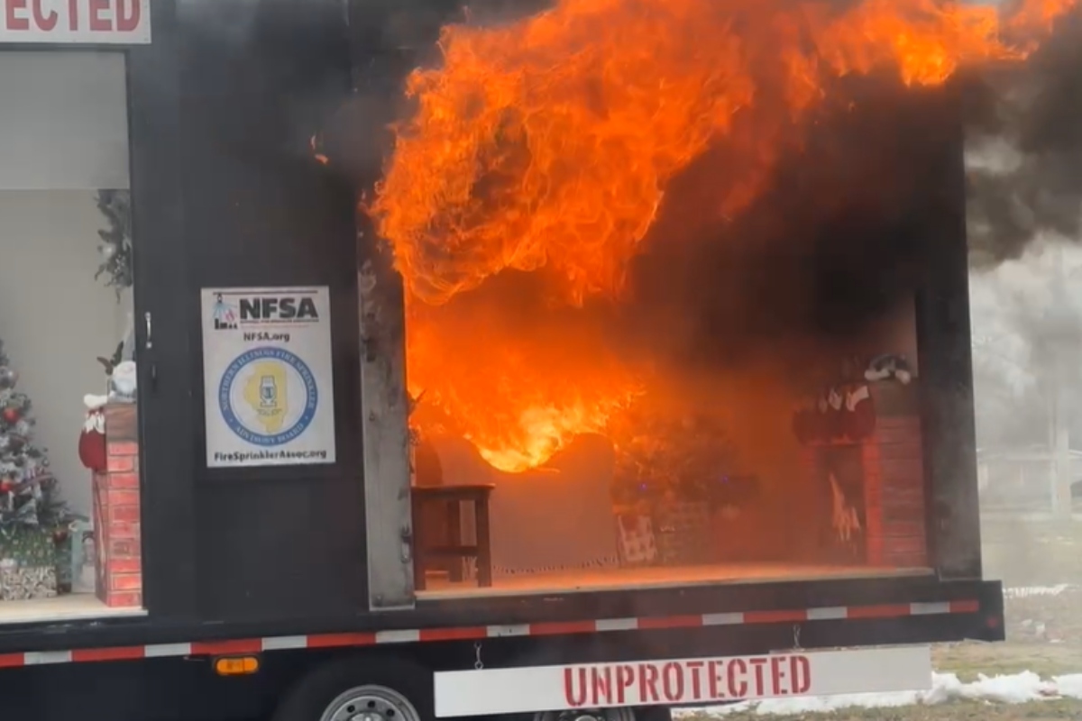 A demonstration trailer shows how quickly a fire can flare up in a home -- in this case, due to a candle being near a Christmas tree and presents.